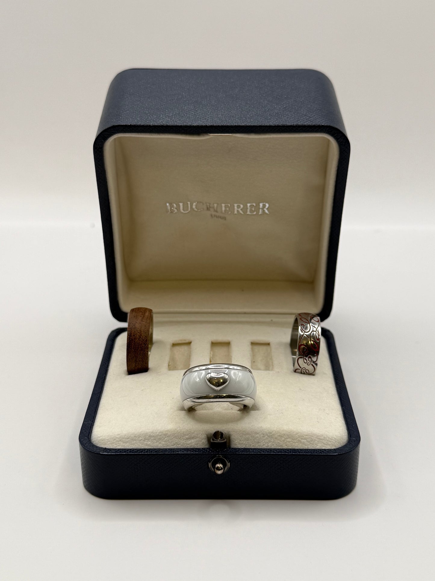 Bague Bucherer Vario – Or blanc 18k + 3 anneaux interchangeables (céramique, bois, acier émaillé)