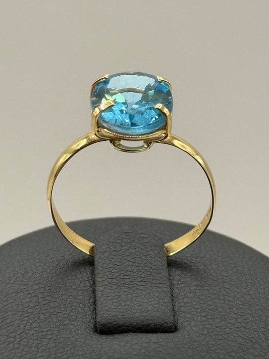 Bague en or jaune ornée dune topaze bleue  taille 56 bijou de luxe