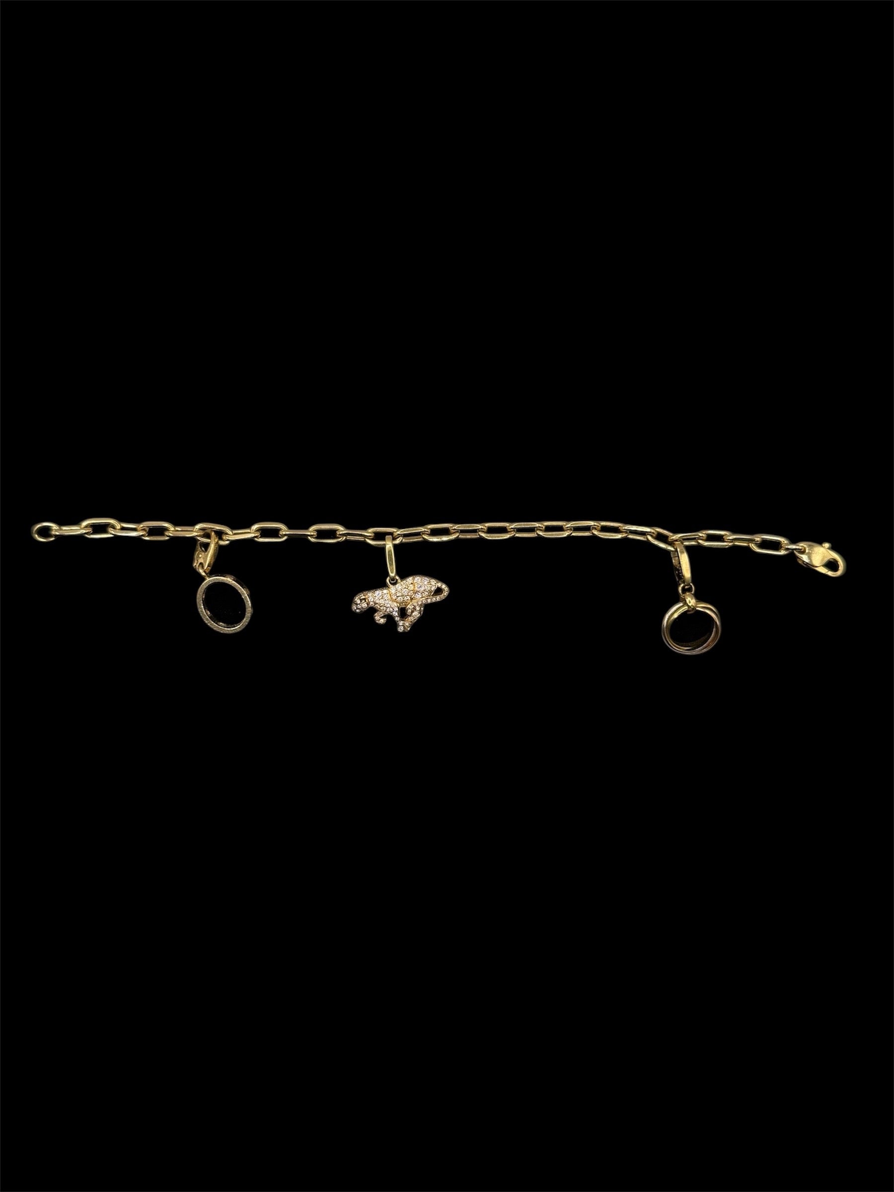 Bracelet Cartier à breloques en or jaune et diamants taille 18 bijou de luxe